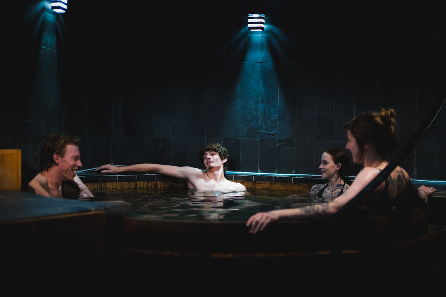Guests soaking together in the cedar hot tub at The Dragontree Sanctuary in Boulder
