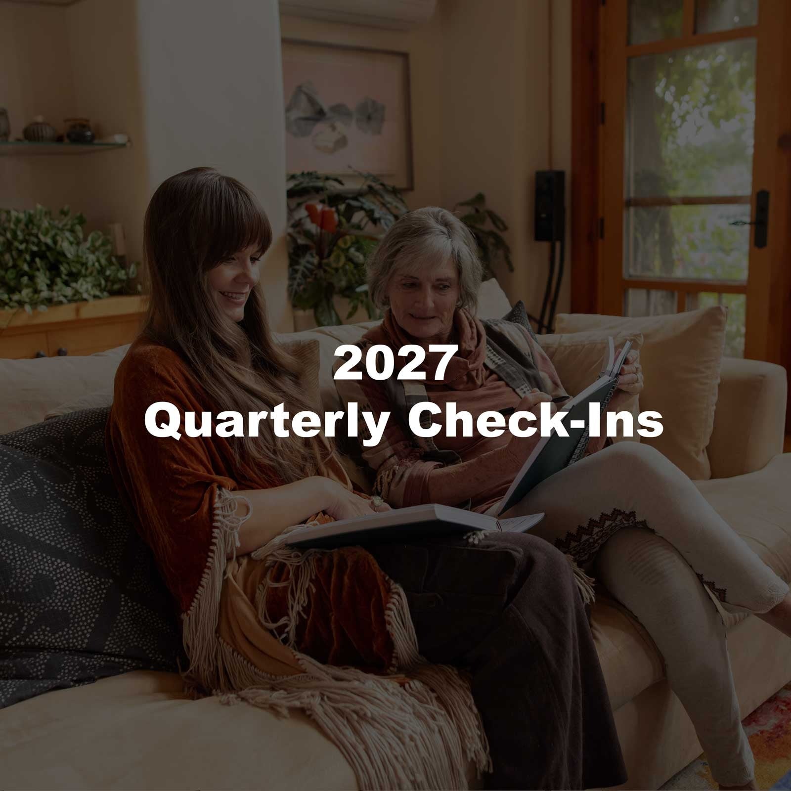 Two women reading their Dreambooks together on a sofa, with the text 2027 Quarterly Check-Ins