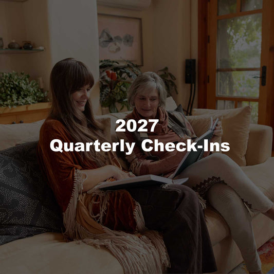Two women reading their Dreambooks together on a sofa, with the text 2027 Quarterly Check-Ins