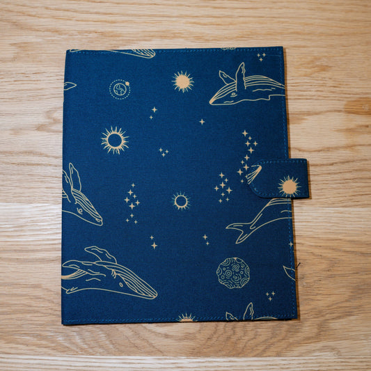 The Star Song cover: navy printed with gold whales, stars, and planets