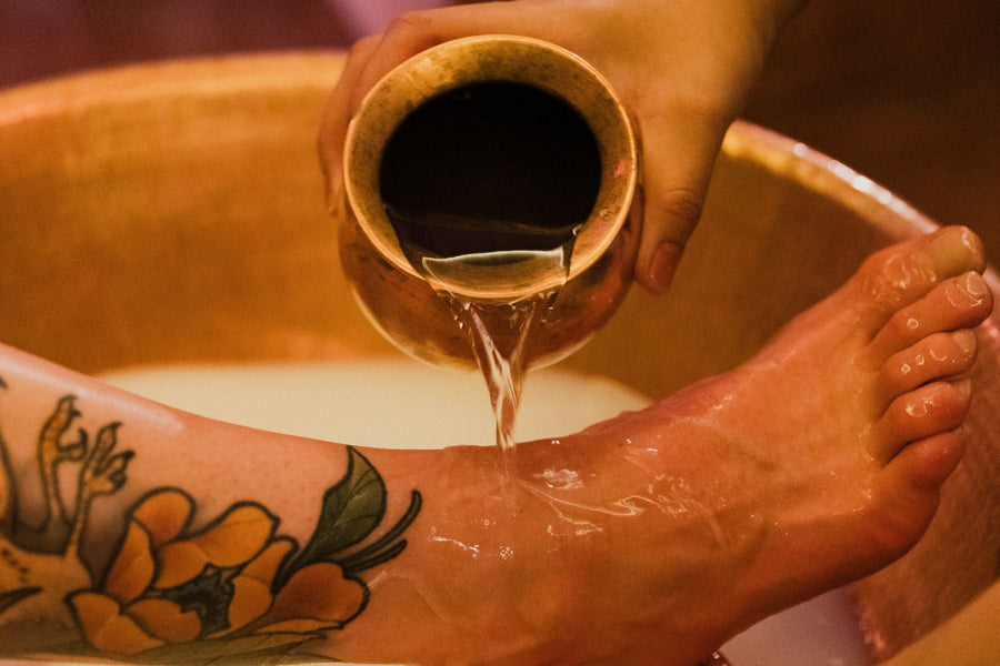 A guest enjoying a foot bath in the Sangha Room