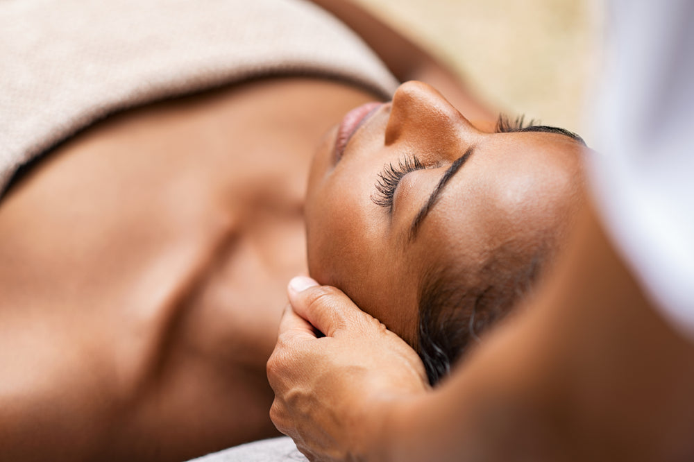 A guest relaxing during a facial