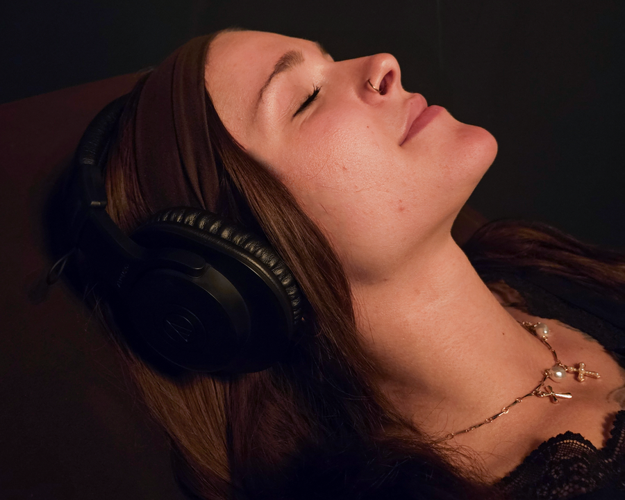 A guest resting with her eyes closed